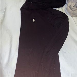 A thick knitted black polo pullover
